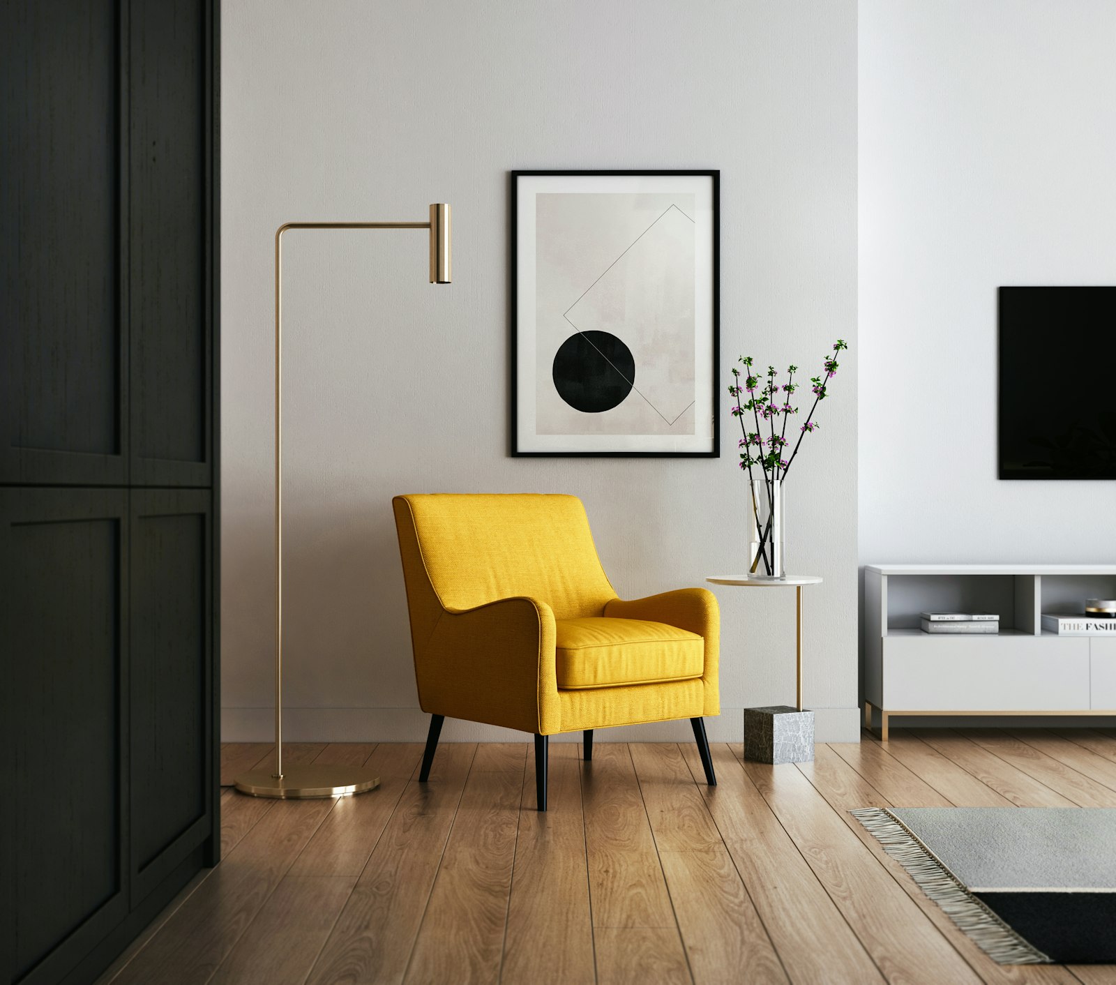 Sunlit living room with a yellow armchair, a brass floor lamp, and a dark screen on the wall